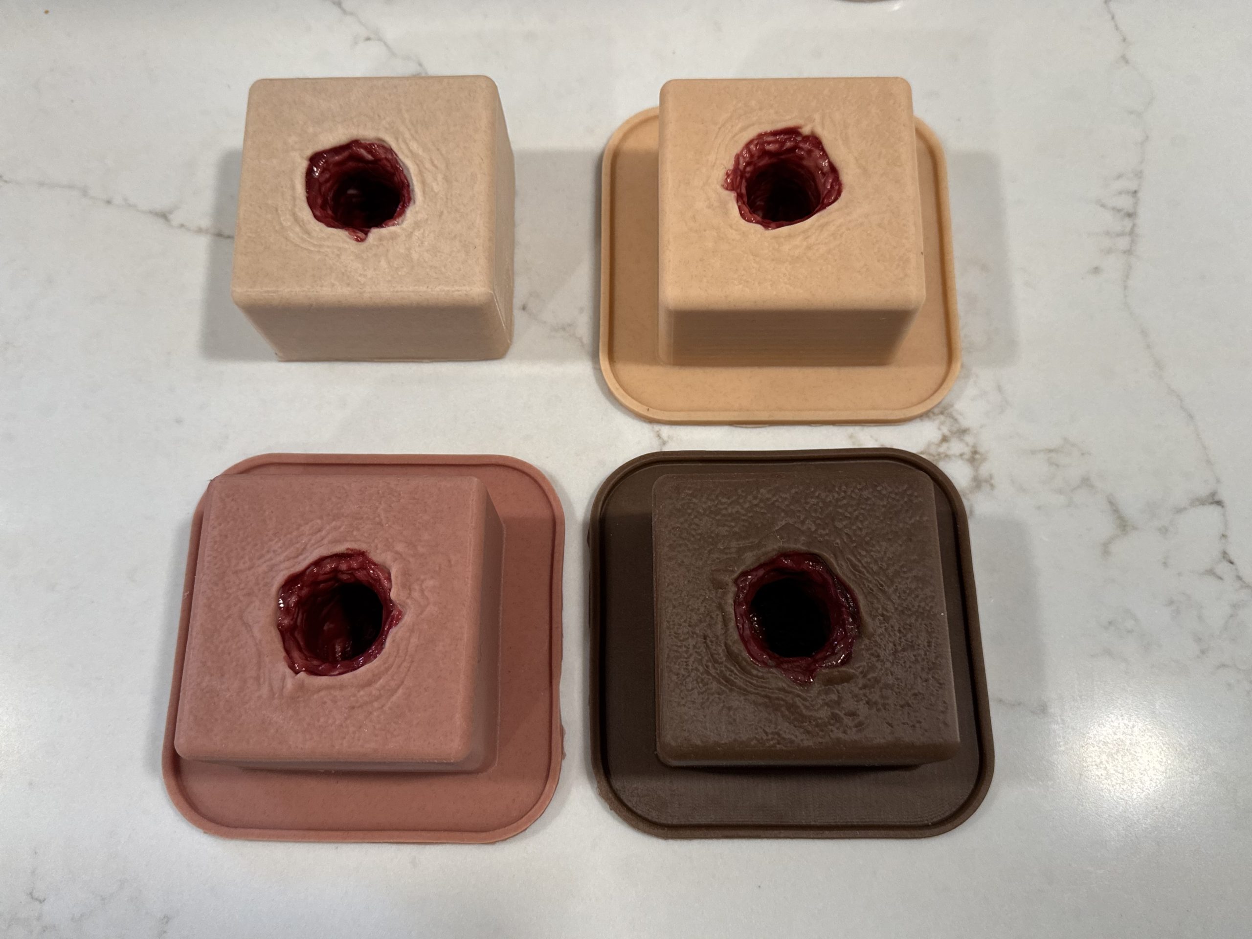 4 different skin pigments on gunshot wound packing trainer.