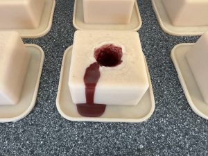 Wound packing trainer with leaking blood.